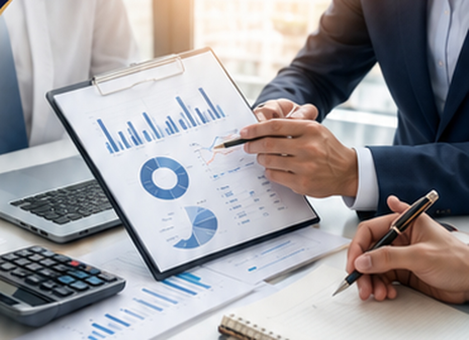 Financial professionals reviewing accounting reports